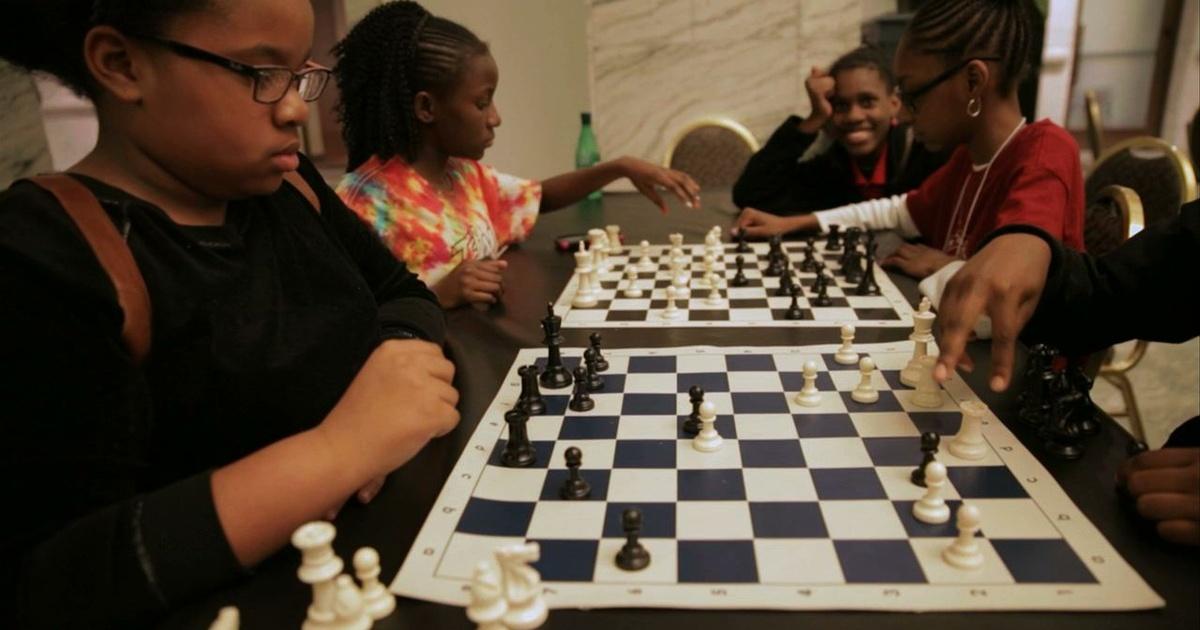 Young Detroit chess players compete against international master