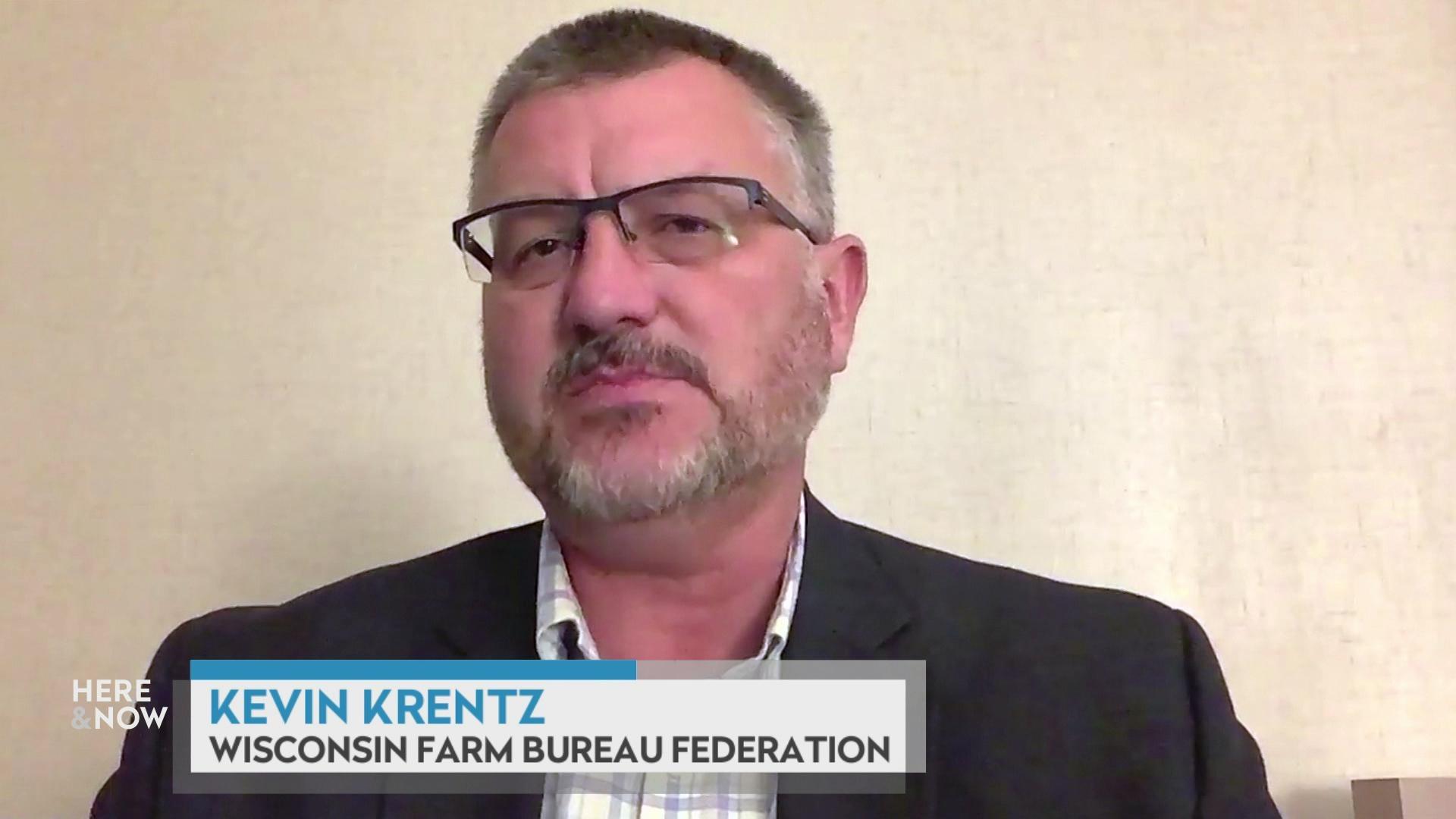 A still image from a video shows Kevin Krentz seated in front of a blank white wall with a graphic at bottom reading 'Kevin Krentz' and 'Wisconsin Farm Bureau Federation.'
