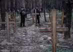 Ukraine examines bodies recovered from mass graves