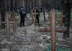 Ukraine examines bodies recovered from mass graves