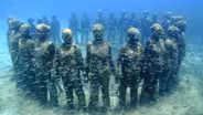 Underwater sculptures highlight dangers of climate change