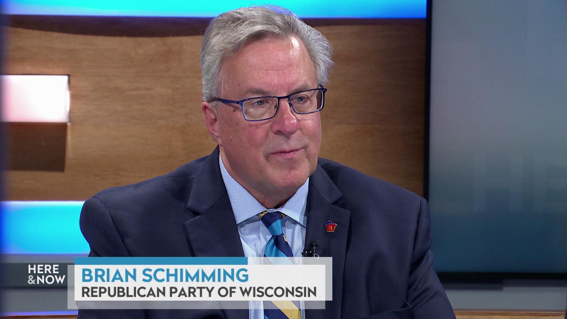 A still image shows Brian Schimming seated at the 'Here & Now' set featuring wood paneling, with a graphic at bottom reading 'Brian Schimming' and 'Republican Party of Wisconsin.'