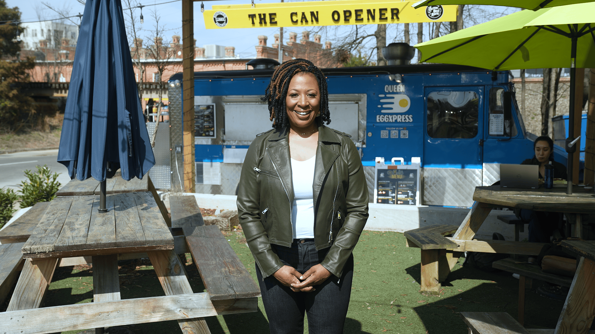 Host of NC Weekend, Deborah Holt Noel in front of The Can Opener food truck park.