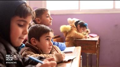 Air strikes don't deter these Syrian school-goers