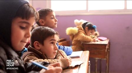 Video thumbnail: PBS NewsHour Air strikes don't deter these Syrian school-goers