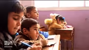 Air strikes don't deter these Syrian school-goers