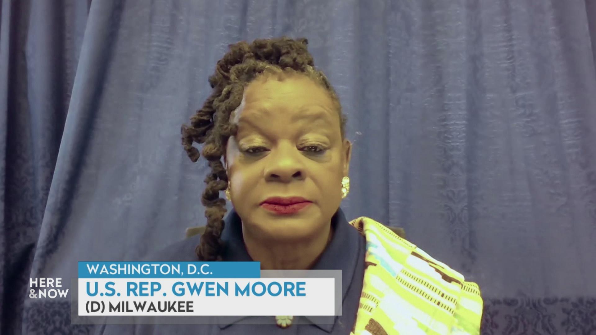 A still image from a video shows Gwen Moore seated in front of a blue curtain with a graphic at bottom reading 'Washington, D.C.,' 'U.S. Rep. Gwen Moore' and '(D) Milwaukee.'