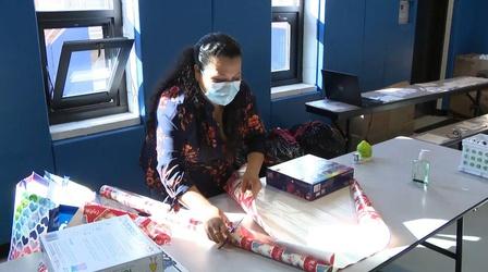 Video thumbnail: NJ Spotlight News Santa's helpers wrap gifts for students in need