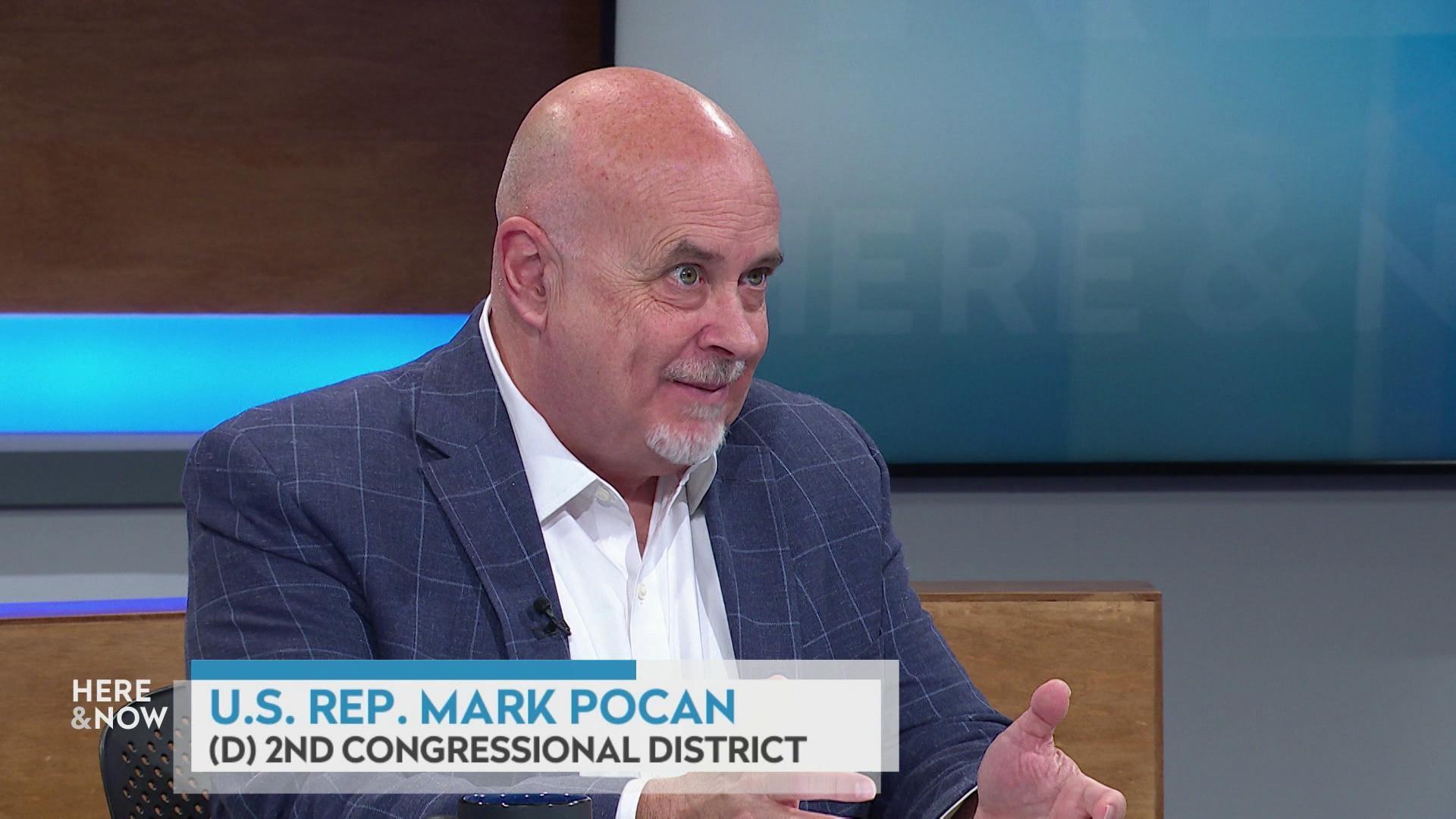 A still image shows Mark Pocan seated at the 'Here & Now' set featuring wood paneling, with a graphic at bottom reading 'U.S. Rep. Mark Pocan' and '(D) 2nd Congressional District.' A still image shows Mark Pocan seated at the 'Here & Now' set featuring wood paneling, with a graphic at bottom reading 'U.S. Rep. Mark Pocan' and '(D) 2nd Congressional District.'