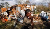 In stricken Panama City, relief effort battles dark, debris