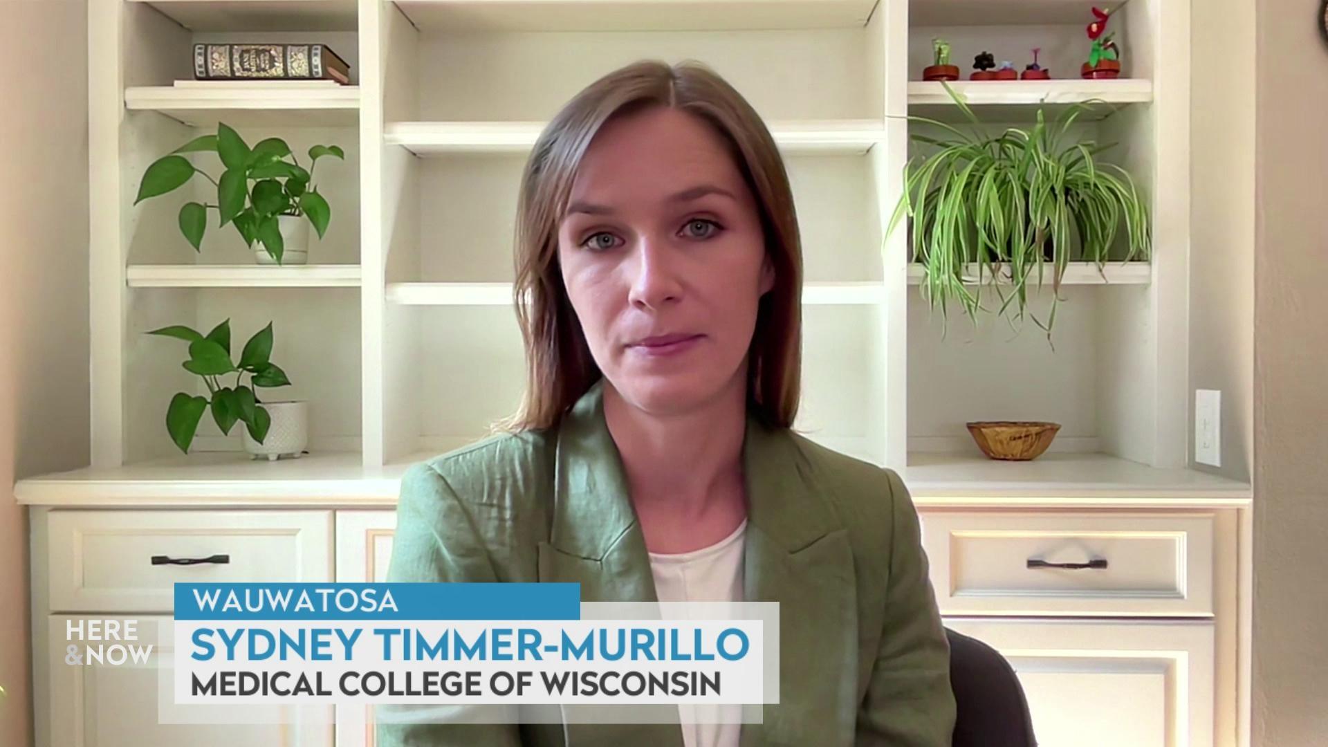 A still image shows Sydney Timmer-Murillo seated in front of a white shelf with various plants, with a graphic at the bottom that reads 'Wauwatosa,' 'Sydney Timmer-Murillo' and 'Medical College of Wisconsin.'
