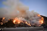 Windy conditions keep California burning--and its power out