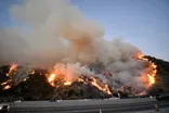 Windy conditions keep California burning--and its power out
