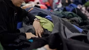 Distributing clothing donations to migrants in Denver