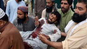 Video thumbnail: PBS NewsHour News Wrap: Deadly bombings kill scores at election rallies