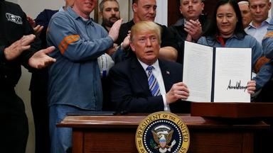 Imposing tariffs, Trump claims national security is at stake