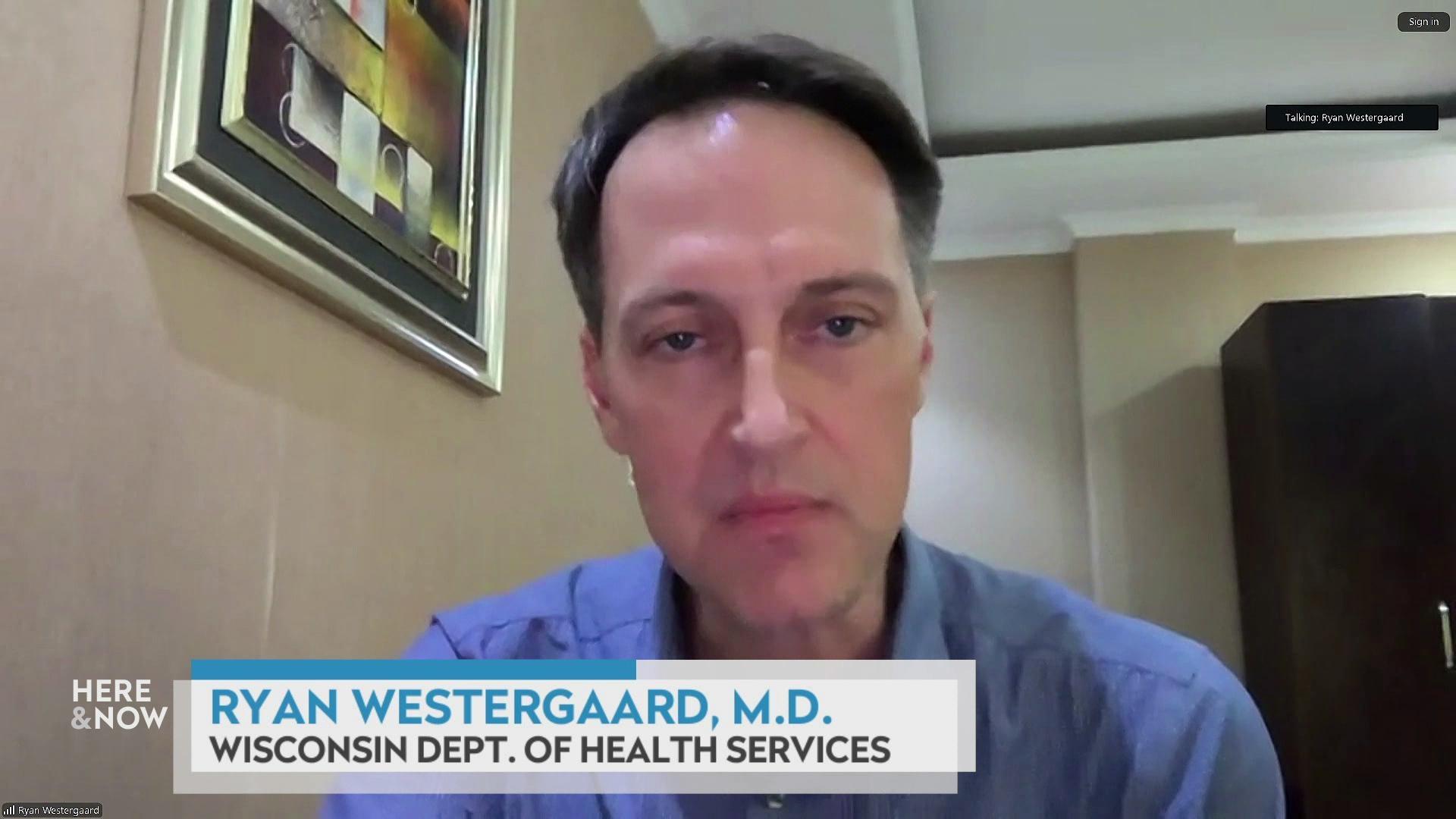 A still image shows Dr. Ryan Westergaard seated in front of an abstract painting, with a graphic at the bottom that reads 'Ryan Westergaard, M.D.' and 'Wisconsin Dept. of Health Services.'