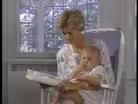 Pat Miles reads to her baby