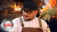 Watch DLEÑA Cook a Perfectly Juicy Steak Over Charcoal and Firewood