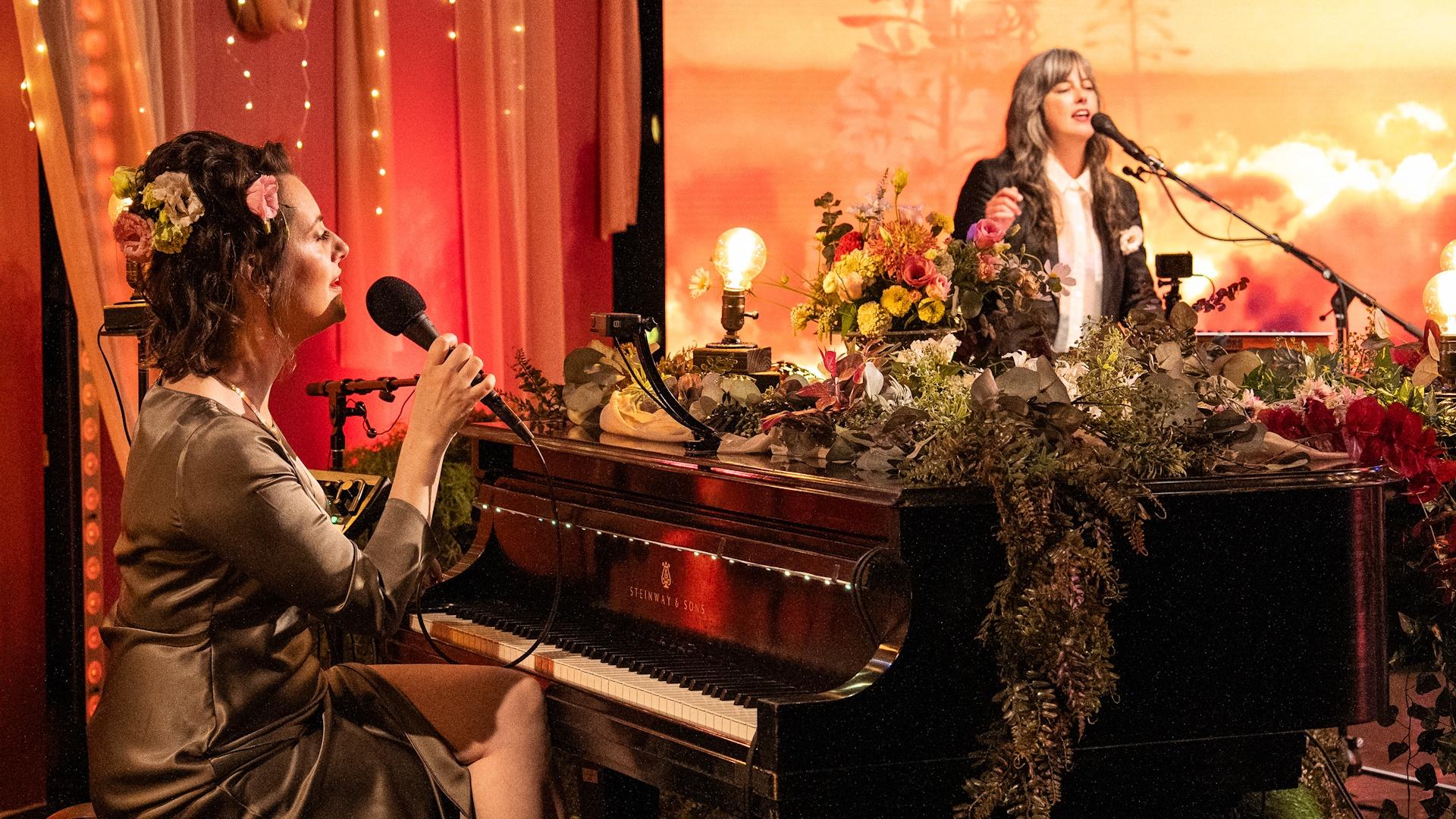 Singer-songwriter Skylar Gudasz behind a grand piano on the set of Shaped by Sound.