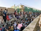 Afghan evacuees wait hours in the heat due to Kabul backlog