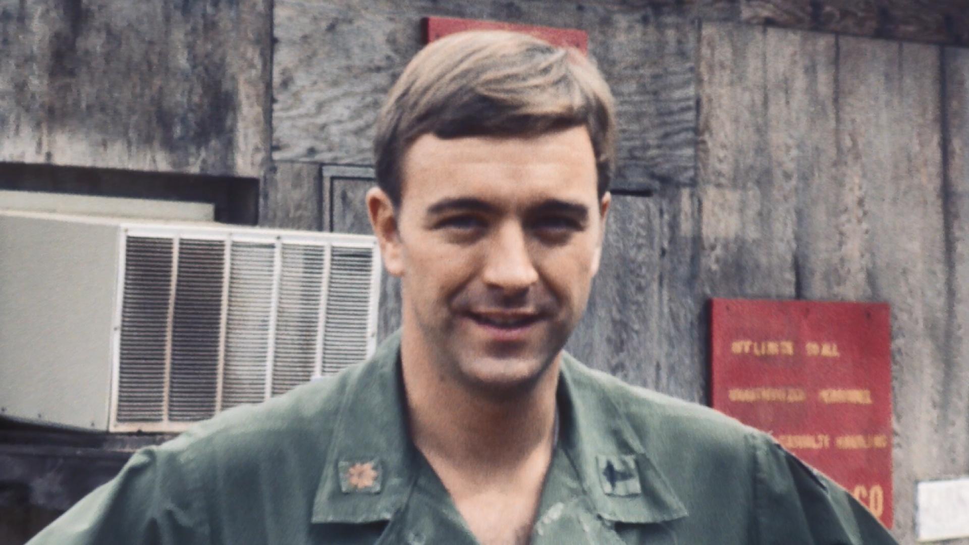 Image shows American soldier in Vietnam posing for a photo.