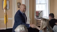 MacArthur accuses Democratic challenger of resume padding