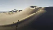 What Makes These Dunes Sing?