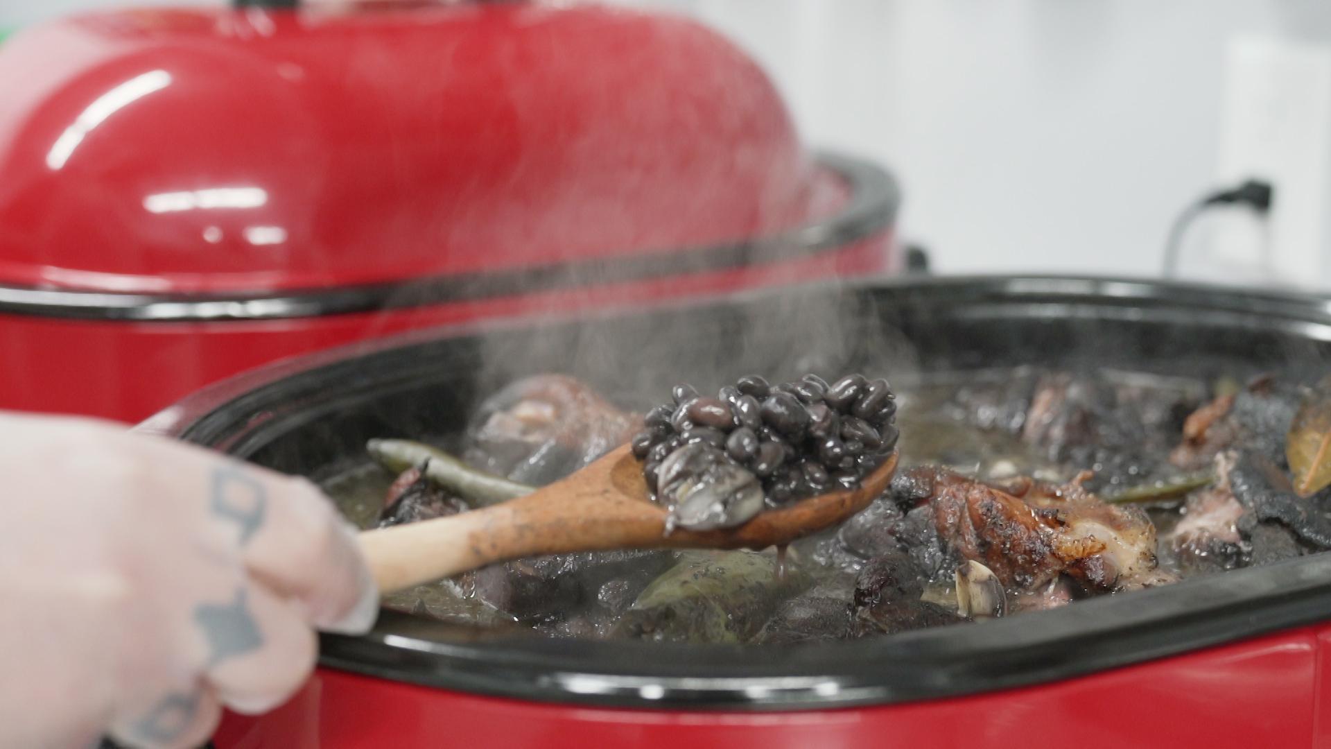 A still image shows a chef stirring a large pot.