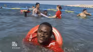 Swim lessons help refugees put trust in once-perilous seas