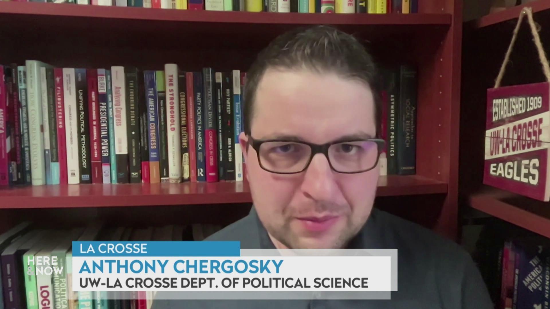 A still image shows Anthony Chergosky standing in front of a bookshelf, with a graphic at the bottom that reads 'La Crosse,' 'Anthony Chergosky' and 'UW-La Crosse dept. of political science.'