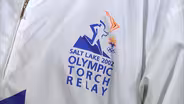 Appraisal: 2002 Salt Lake City Olympic Torch & Runners Suit