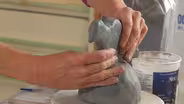 Ceramic artist Susan Garson builds a bird menorah