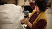 Yumei Hou on the large ram in the Chinese New Year parade