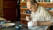 Jeff Oestreich decorates bisque ware