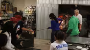 Therman Statom collaborates with students to make glass head