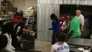 Therman Statom collaborates with students to make glass head