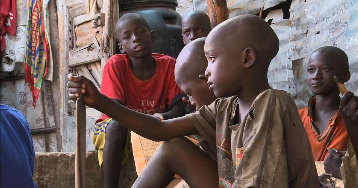 PBS News Hour | Thousands of Senegalese boys forced into begging system | Season 2014