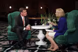 Sen. Mark Warner with Judy Woodruff