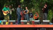 Flood-displaced musicians perform 'Smile' at RockyGrass