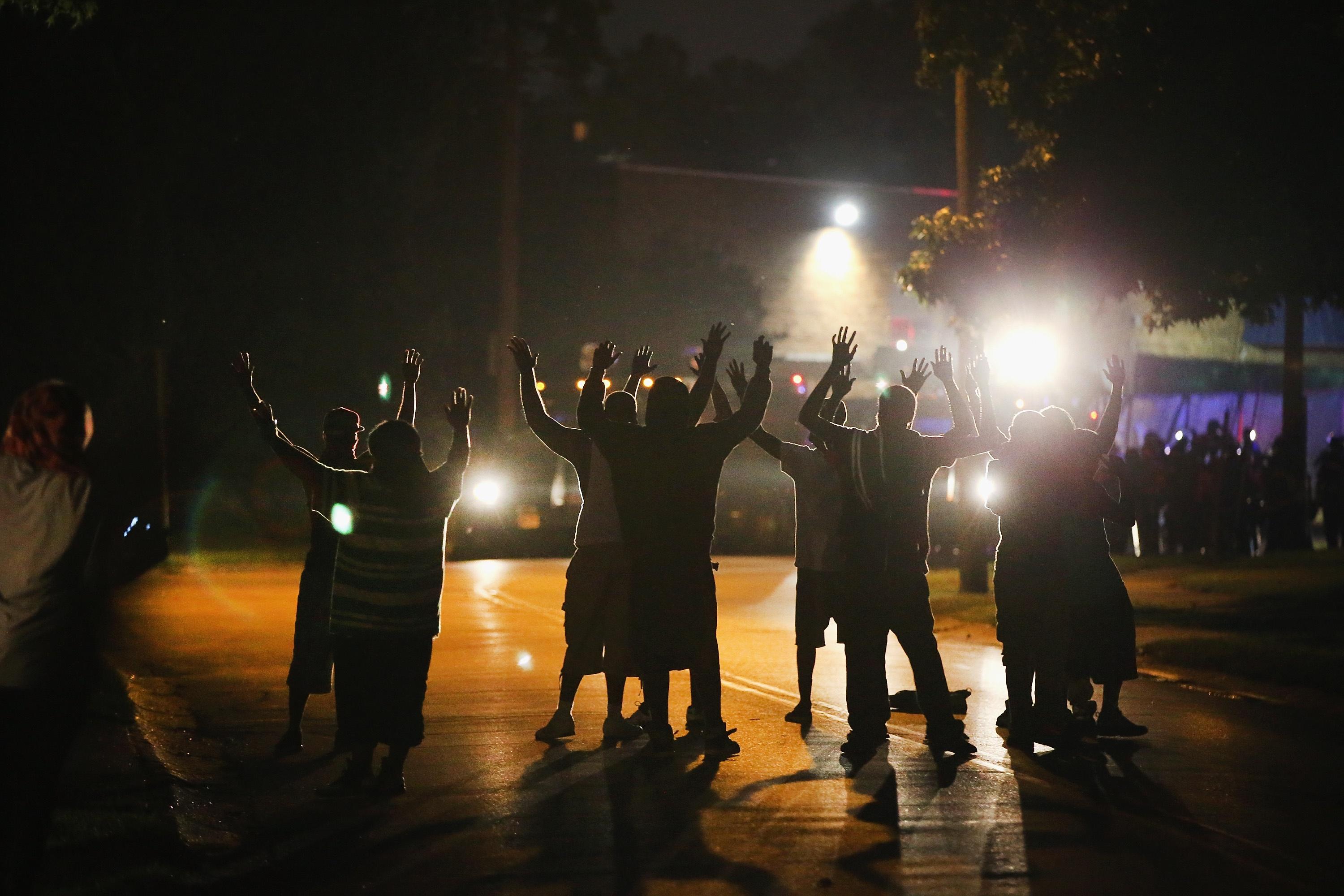 Family of slain Mo. teen call for calm after violent protest