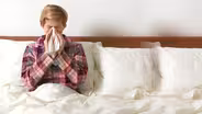 Facing widespread flu, officials urge antiviral drug use