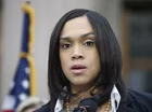 Prosecutor urges calm after police charged in Gray’s death