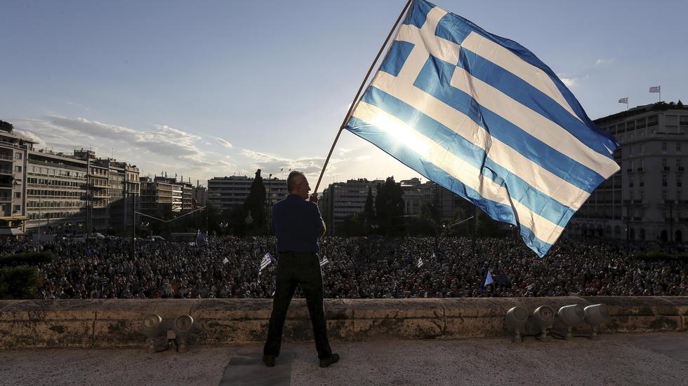 Awaiting debt deal, Greeks resist expected reforms image