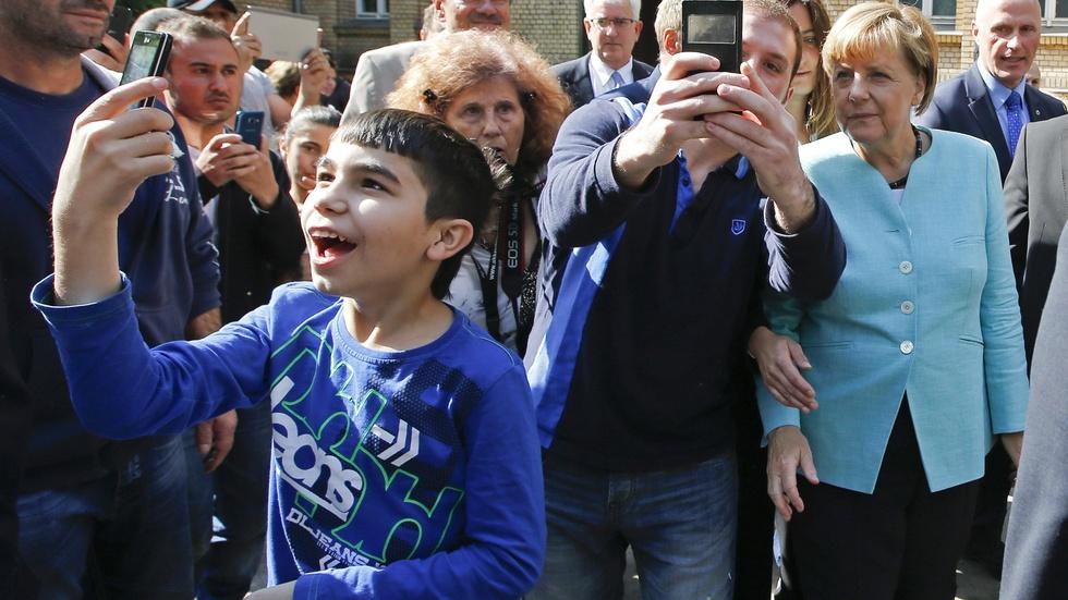 What is Germany doing to help migrants? image