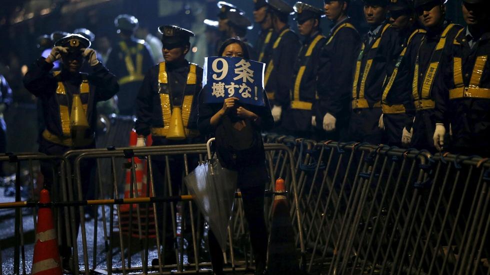 Japan enacts controversial law to nix military limits image