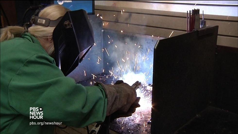 The only girl in school to spark an interest in welding image