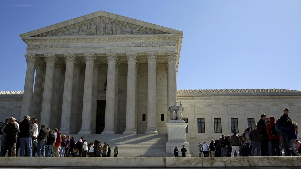Without Scalia, Supreme Court splits on union fees case image