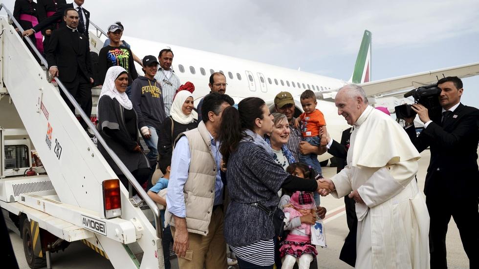Refugees’ journey ends with a ride on the pope’s plane image