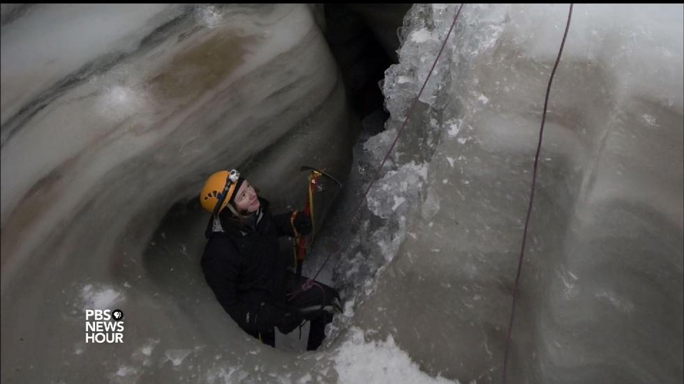 Scientist chases waterfalls in depths of vast glaciers image